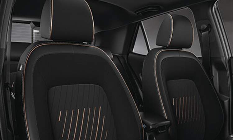 Exclusive black seat upholstery with brass coloured highlights